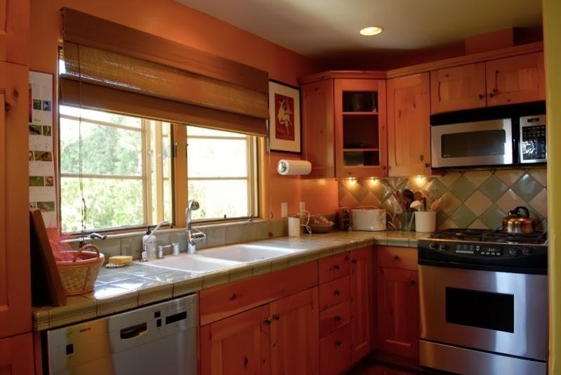1021 Laguna Street, Unit 4 Santa Barbara, CA 93101 - Photo 4 of 13 a kitchen with stainless steel appliances granite countertop a sink stove and microwave