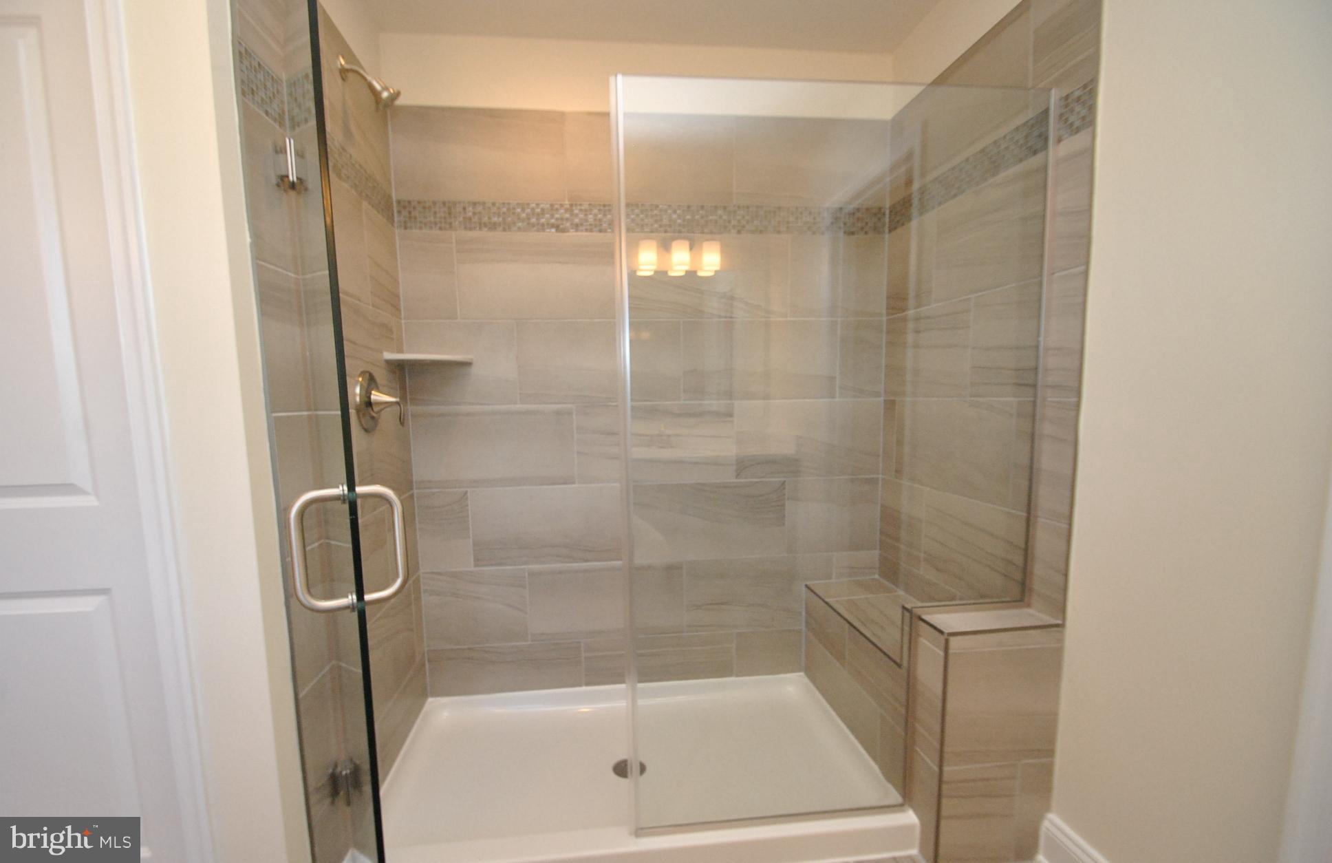 10 Arabella Way Fallston, MD 21047 - Photo 19 of 29 OWNERS SHOWER W/SEAT & UPGRADED TILE PACKAGE