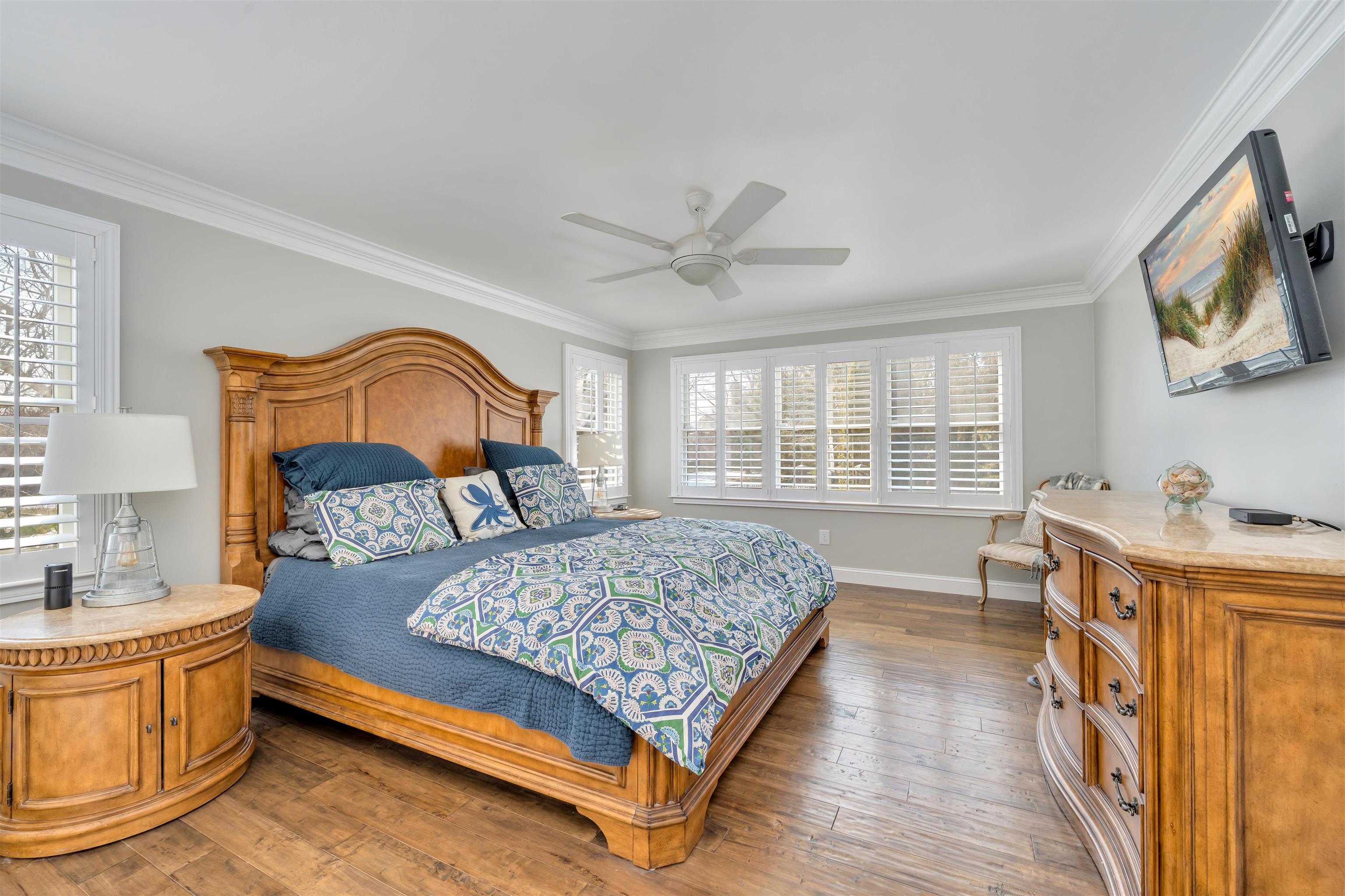 23 Taylor Cold Spring Cape May, NJ 08204 - Photo 22 of 50 a bedroom with a bed couch and a flat screen tv