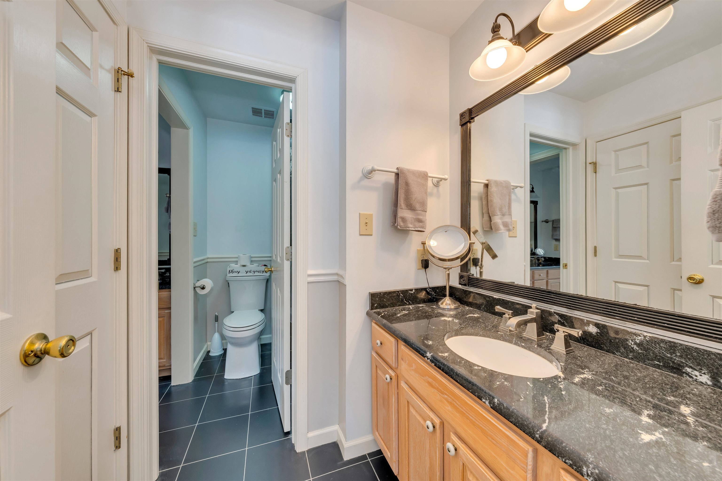 23 Taylor Cold Spring Cape May, NJ 08204 - Photo 33 of 50 a bathroom with a granite countertop sink and a mirror