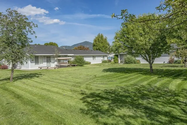 a view of a house with a big yard
