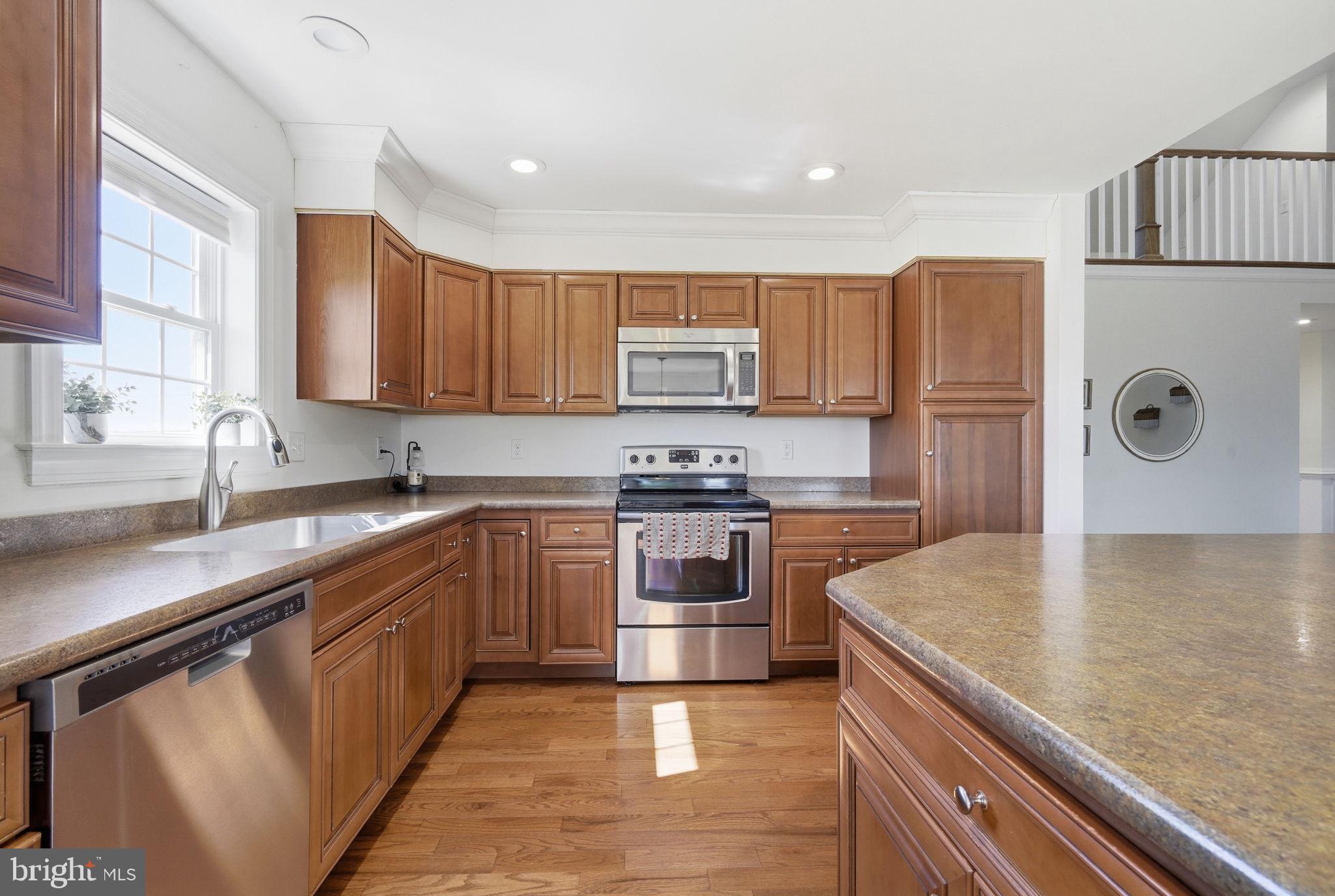615 Ell Downes Road Henderson, MD 21640 - Photo 9 of 58 Modern kitchen with warm wood tones.
