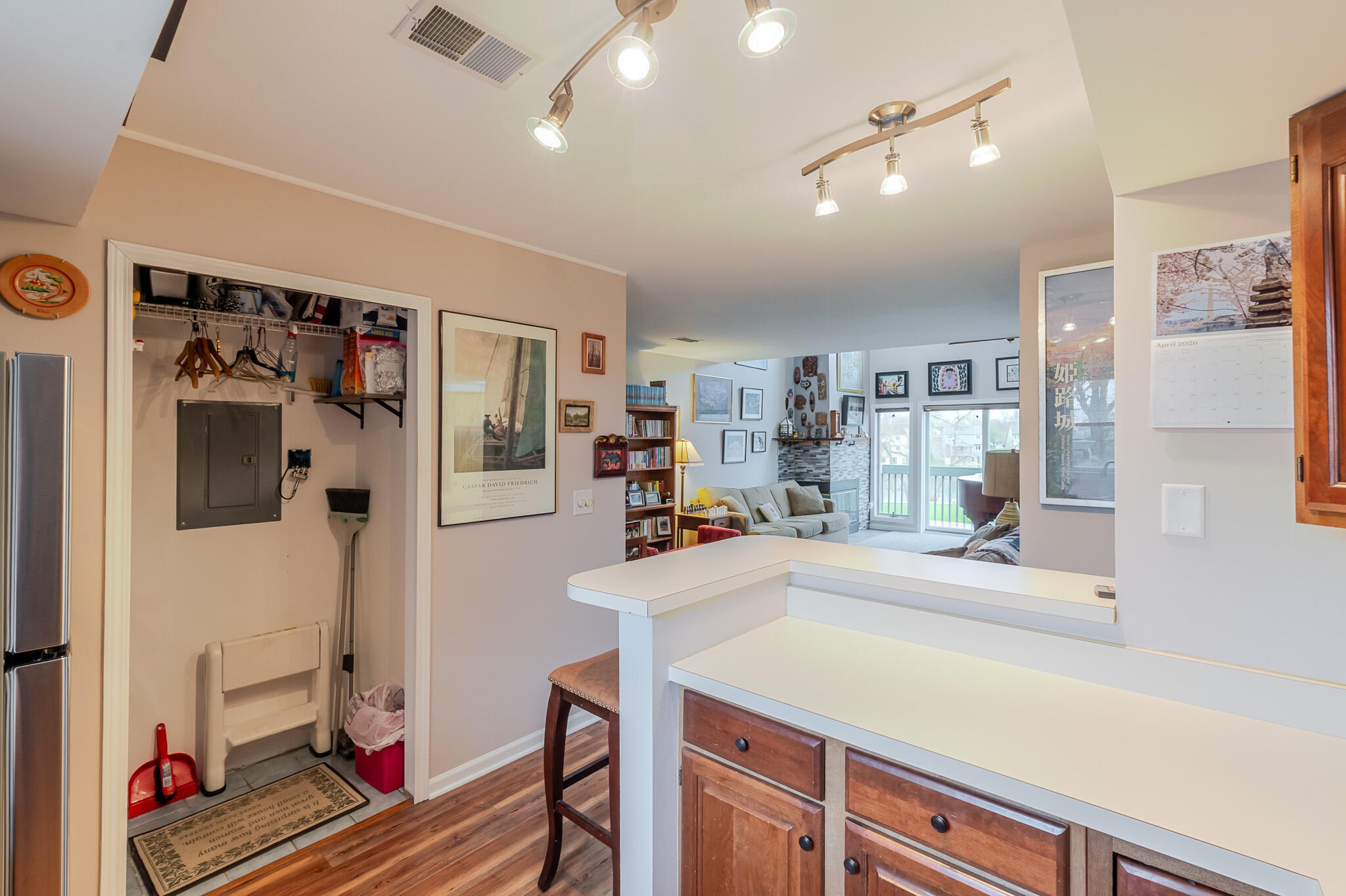 1300 Winding Ridge Lane, Unit A7 Valparaiso, IN 46383 - Photo 13 of 32 a kitchen with stainless steel appliances kitchen island granite countertop a refrigerator and microwave