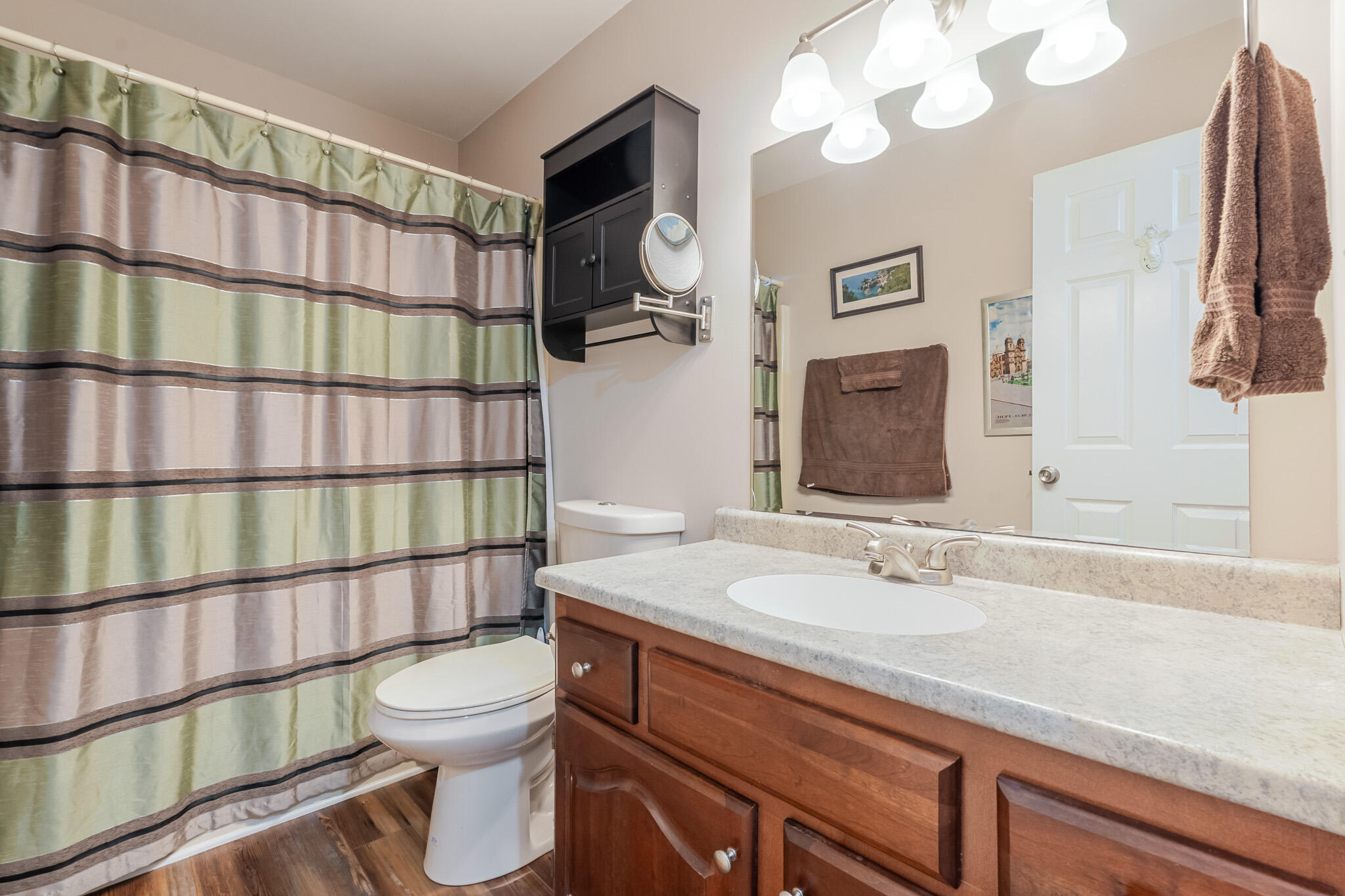 1300 Winding Ridge Lane, Unit A7 Valparaiso, IN 46383 - Photo 16 of 32 a bathroom with a sink a toilet and shower curtain