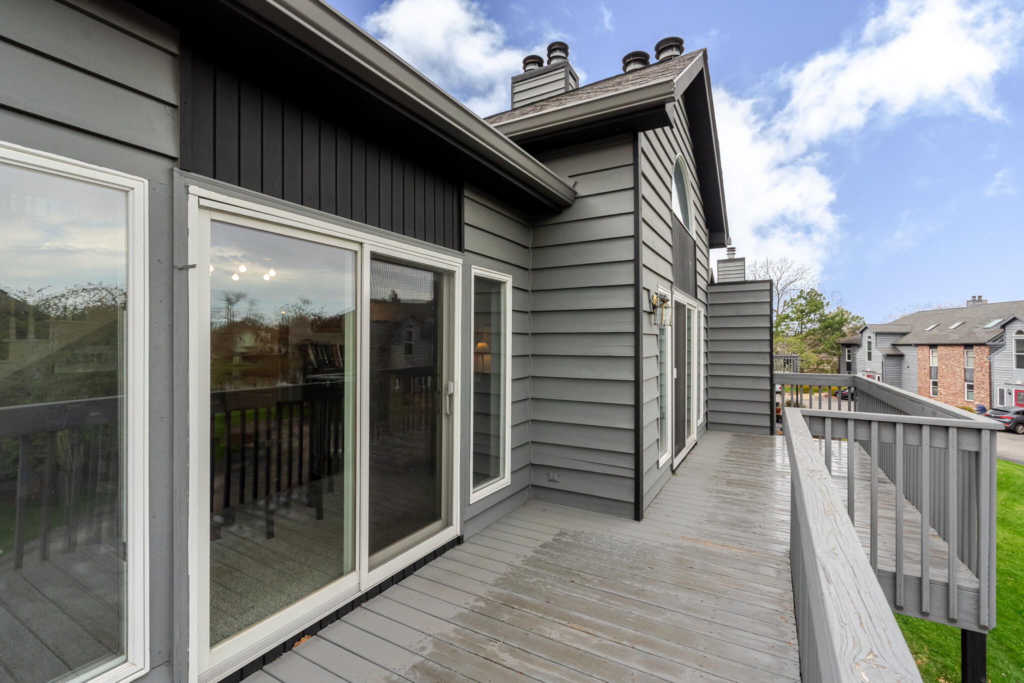 1300 Winding Ridge Lane, Unit A7 Valparaiso, IN 46383 - Photo 24 of 32 a view of a balcony with furniture and floor to ceiling window