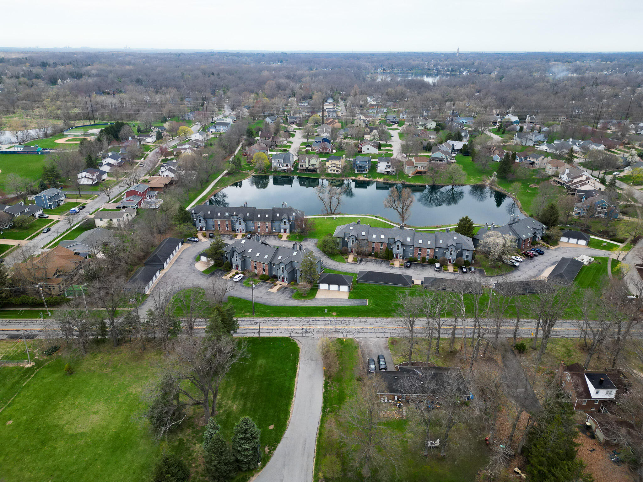 1300 Winding Ridge Lane, Unit A7 Valparaiso, IN 46383 - Photo 27 of 32 an aerial view of a city with lots of residential buildings and mountain view in back
