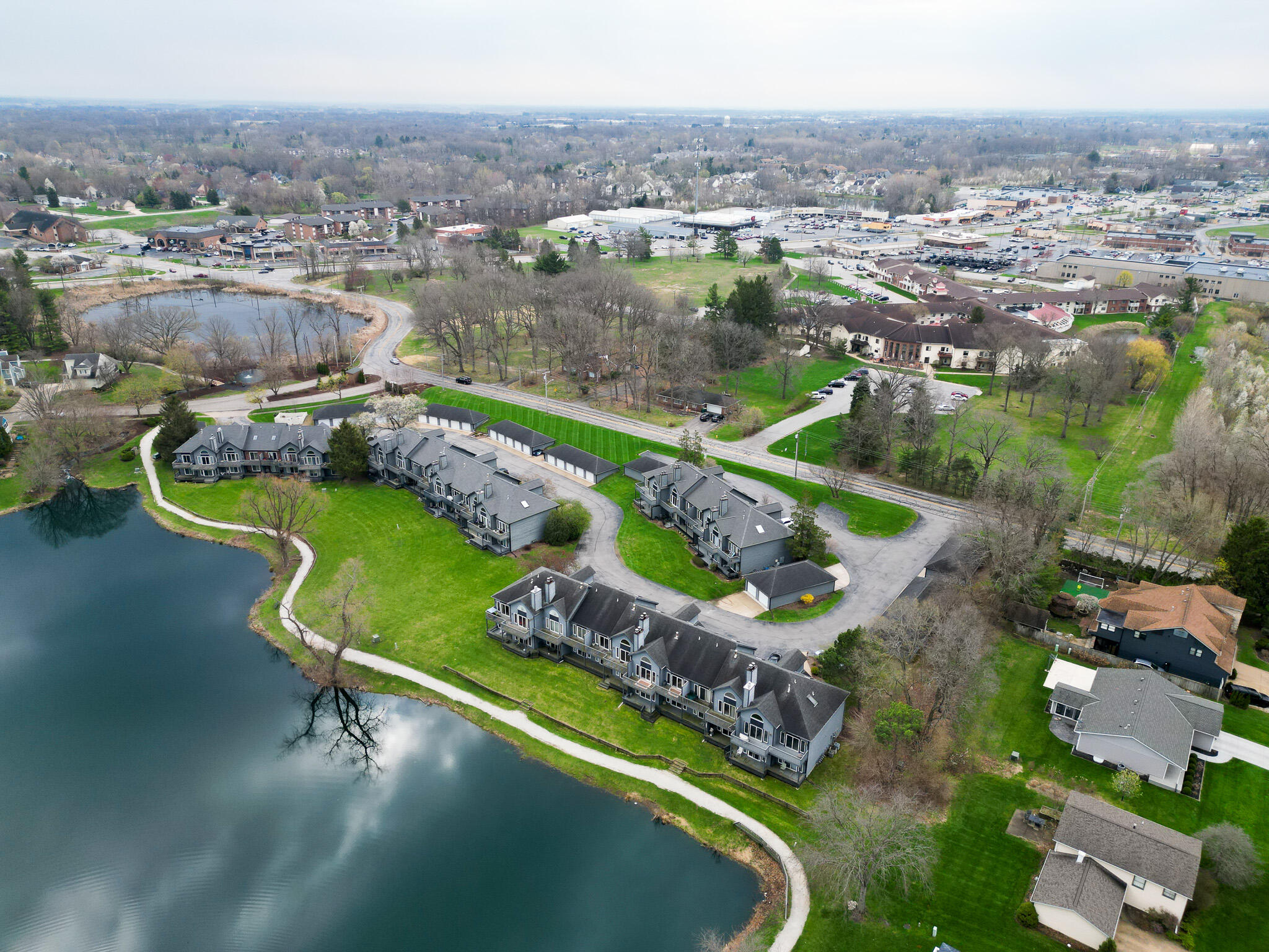 1300 Winding Ridge Lane, Unit A7 Valparaiso, IN 46383 - Photo 29 of 32 an aerial view of a house with a swimming pool outdoor seating and yard