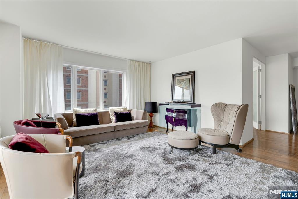 3219 City Place Edgewater, NJ 07020 - Photo 2 of 30 a living room with furniture and wooden floor