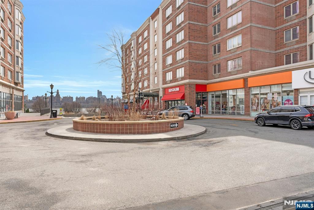 3219 City Place Edgewater, NJ 07020 - Photo 26 of 30 a swimming pool with outdoor seating and yard
