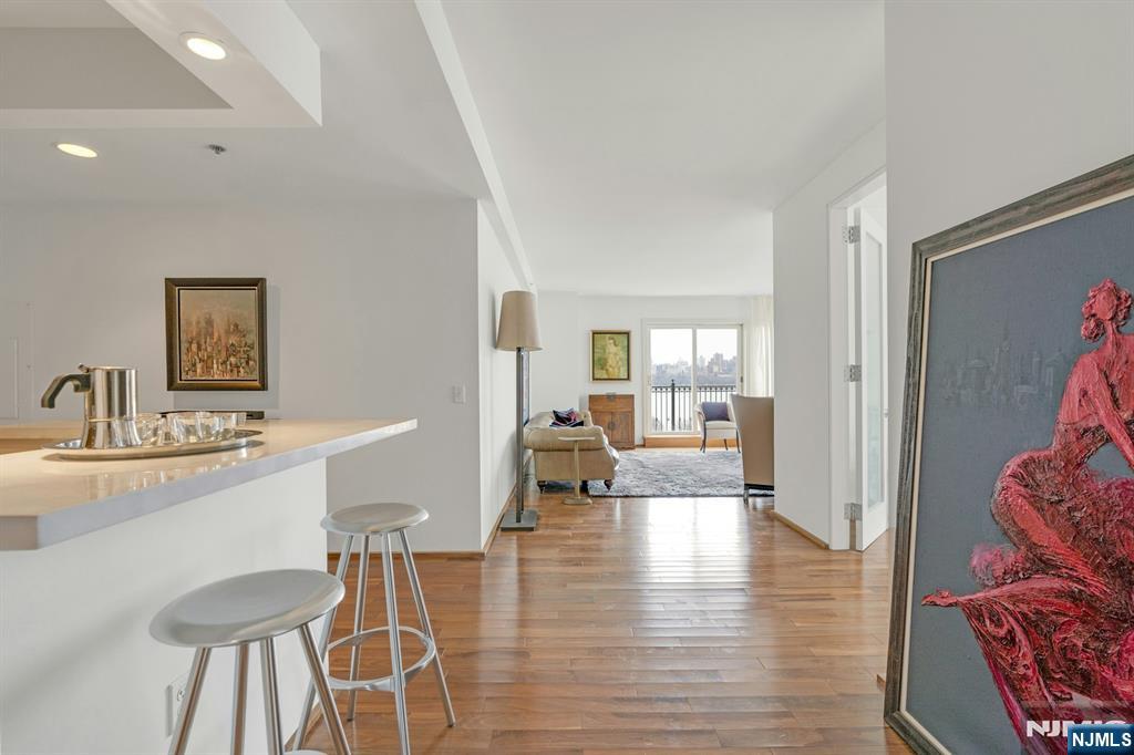 3219 City Place Edgewater, NJ 07020 - Photo 5 of 30 a dining room with furniture and wooden floor