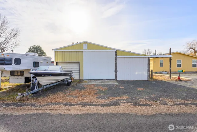 a front view of a house with parking area