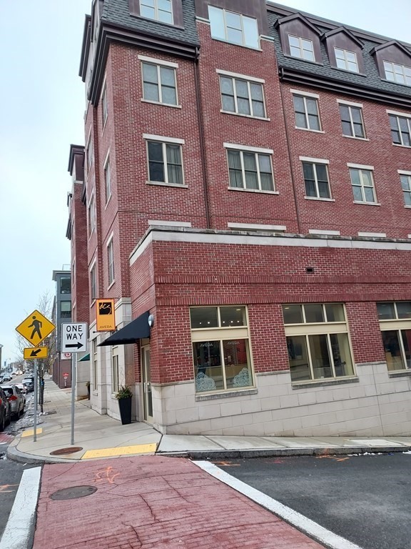 116 Rantoul Street, Unit 408 Beverly, MA 01915 - Photo 1 of 27 a front view of a building
