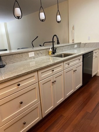 116 Rantoul Street, Unit 408 Beverly, MA 01915 - Photo 11 of 27 a close view of sink and tap