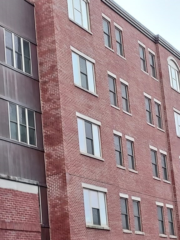 116 Rantoul Street, Unit 408 Beverly, MA 01915 - Photo 3 of 27 a front view of a building