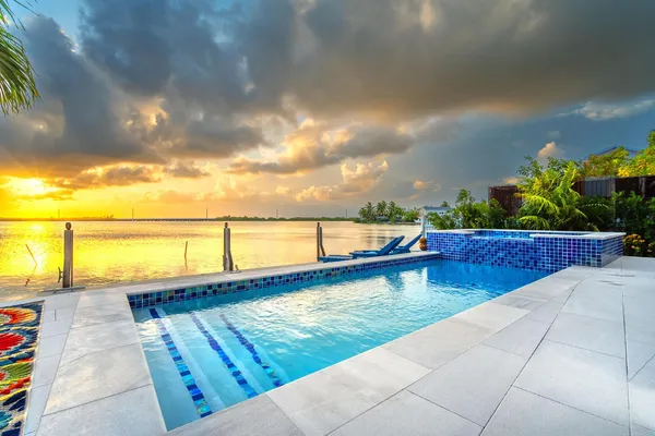 a view of swimming pool with a lounge chair