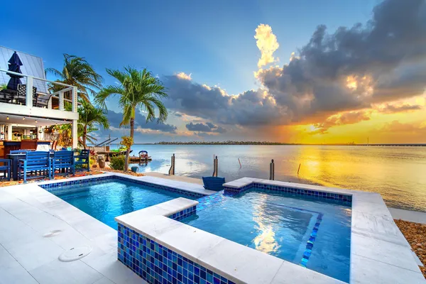 a view of a swimming pool with a lounge chairs