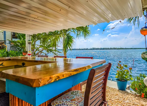 a view of a chair and table in the patio