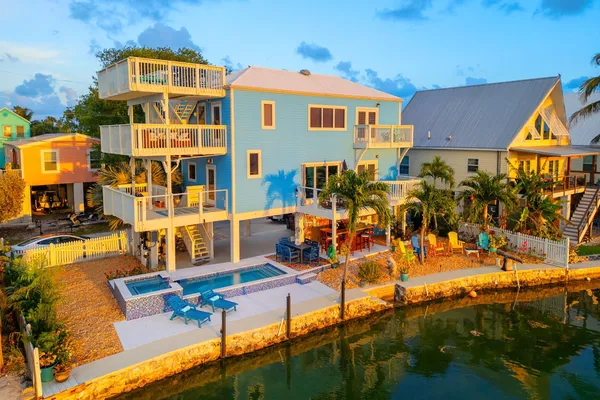 a view of multiple houses with yard