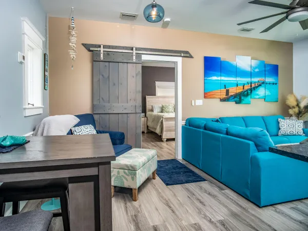 a living room with a bed and furniture