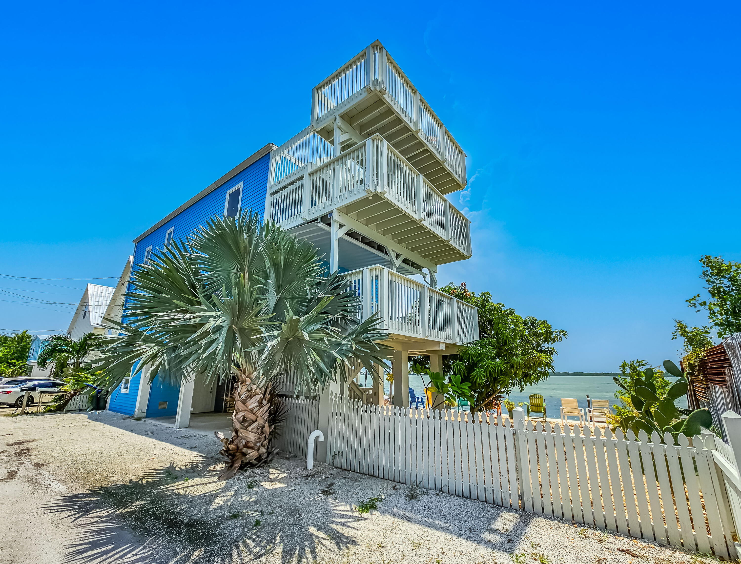 6 Shore Drive Key West, FL 33040 - Photo 3 of 45 a front view of a house with a yard