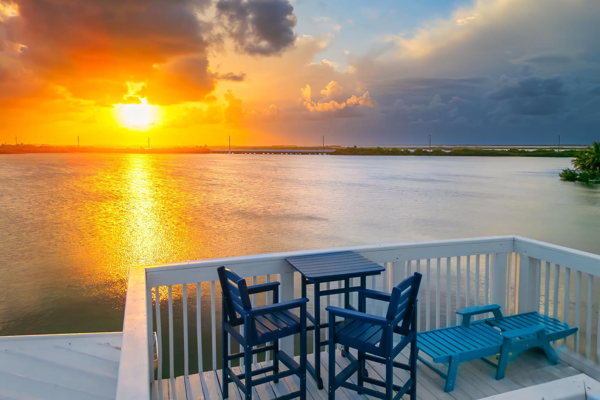 6 Shore Drive Key West, FL 33040 - Photo 45 of 45 a view of a chair and table on the deck