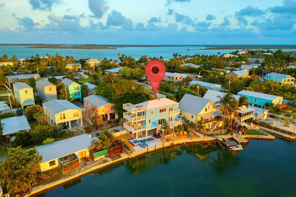an aerial view of residential houses with outdoor space
