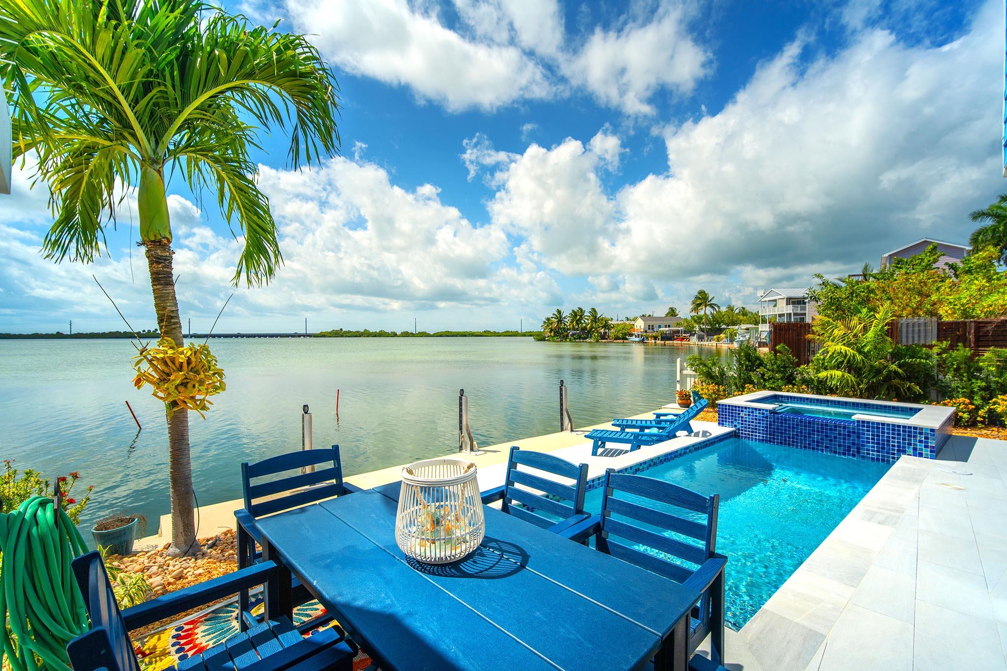 6 Shore Drive Key West, FL 33040 - Photo 9 of 45 a view of a lake with a table and chairs