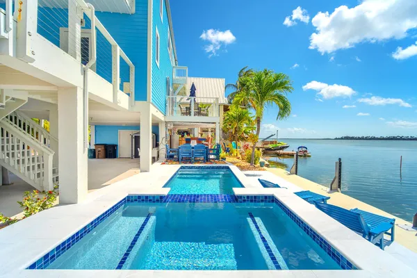 a view of a swimming pool with a lounge chairs