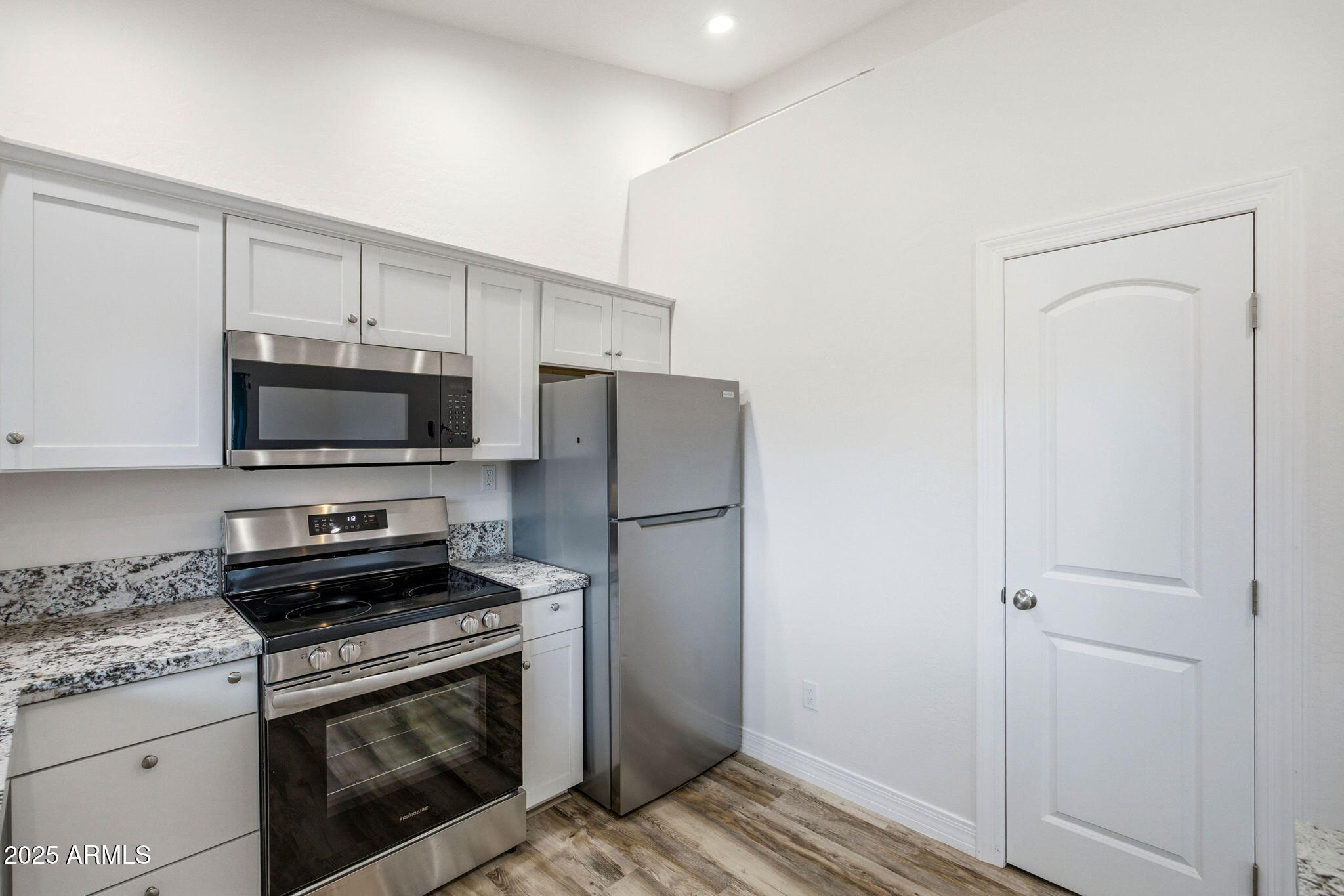 1979 Christmas Pine Road Overgaard, AZ 85933 - Photo 10 of 33 a kitchen with a refrigerator stove and microwave