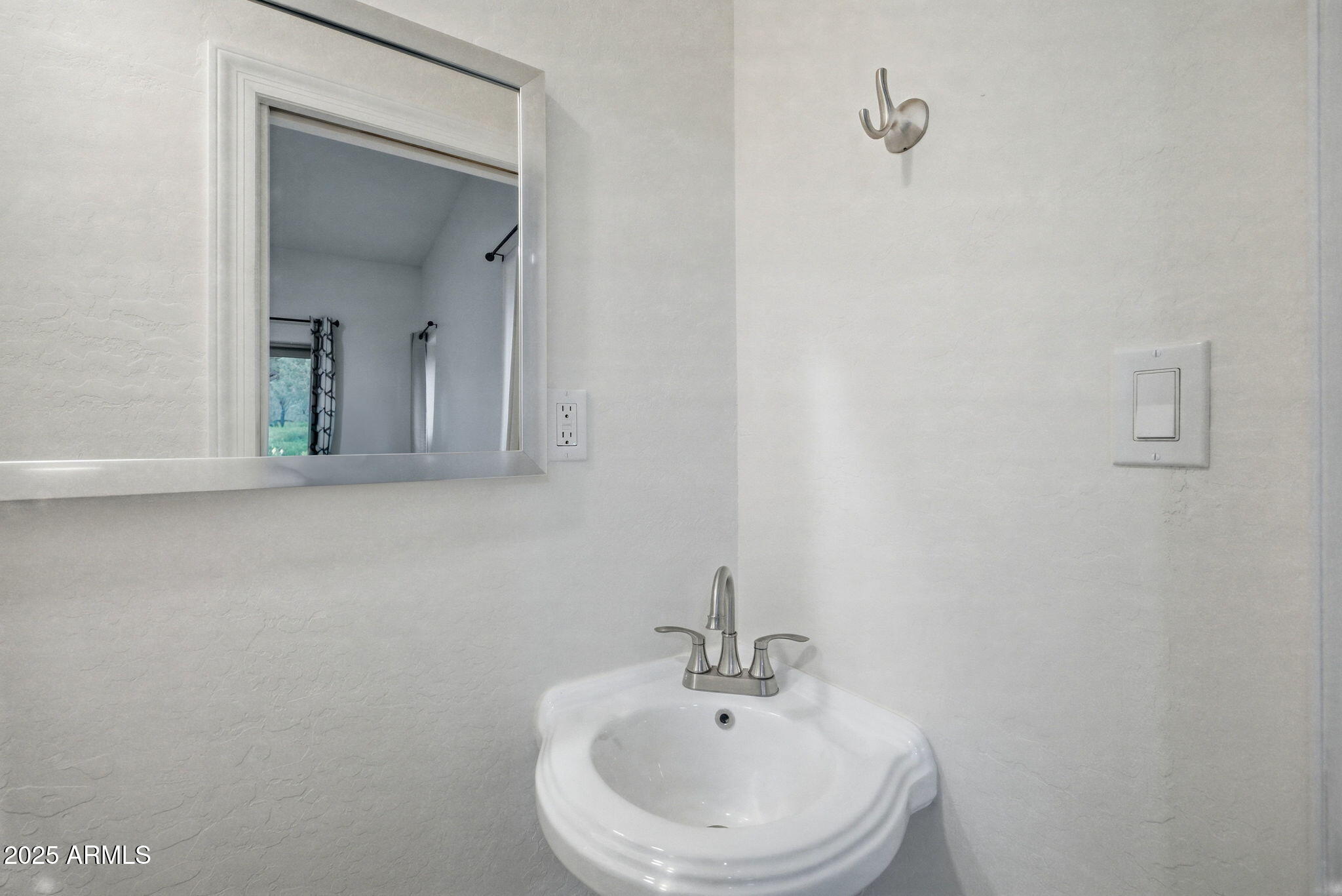 1979 Christmas Pine Road Overgaard, AZ 85933 - Photo 13 of 33 a bathroom with a sink and a mirror
