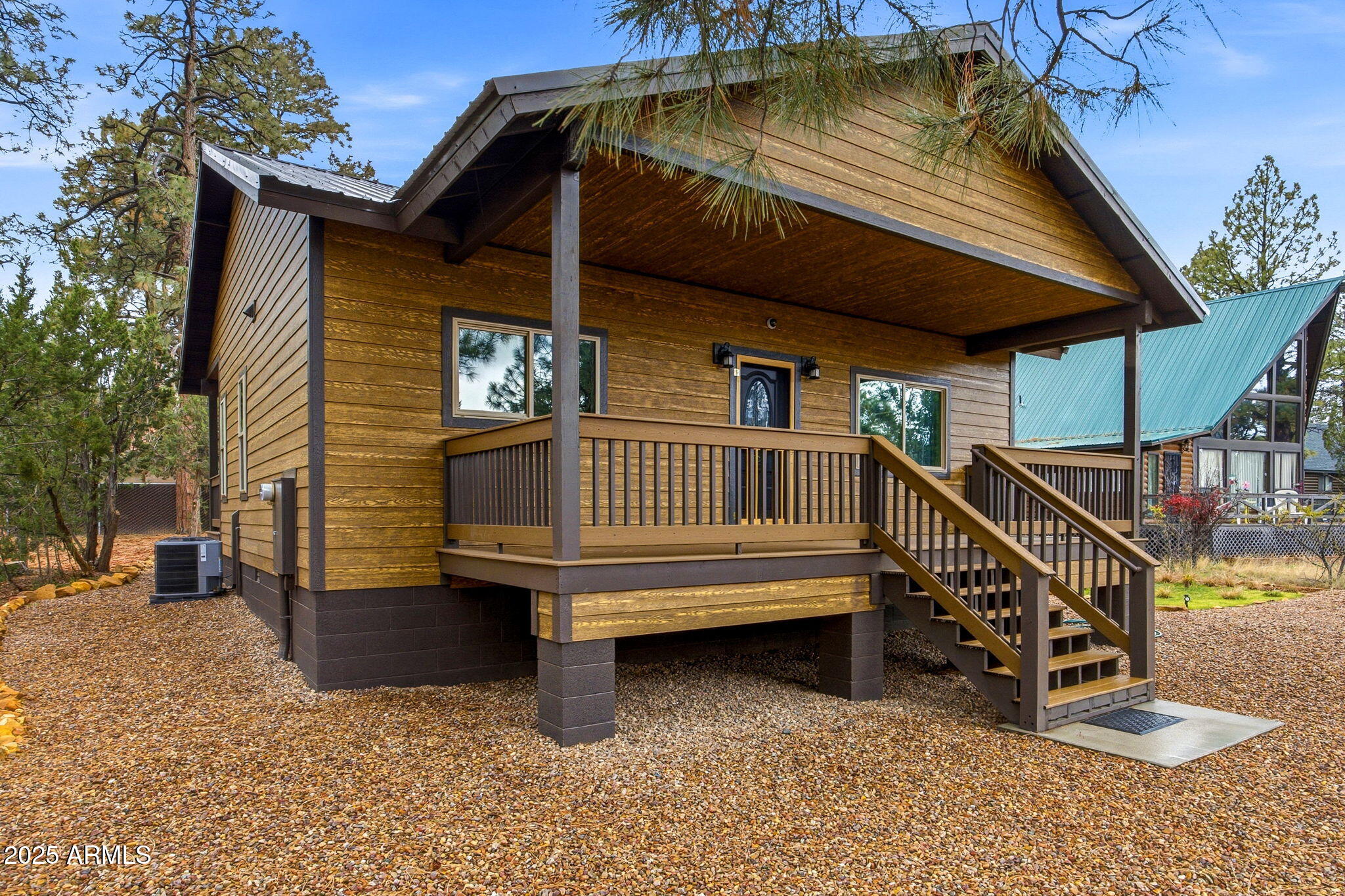 1979 Christmas Pine Road Overgaard, AZ 85933 - Photo 2 of 33 a yellow and white house sitting in front of a house