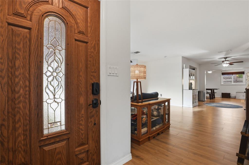 4576 Bliss Road Sarasota, FL 34233 - Photo 5 of 40 a view of a livingroom with wooden floor