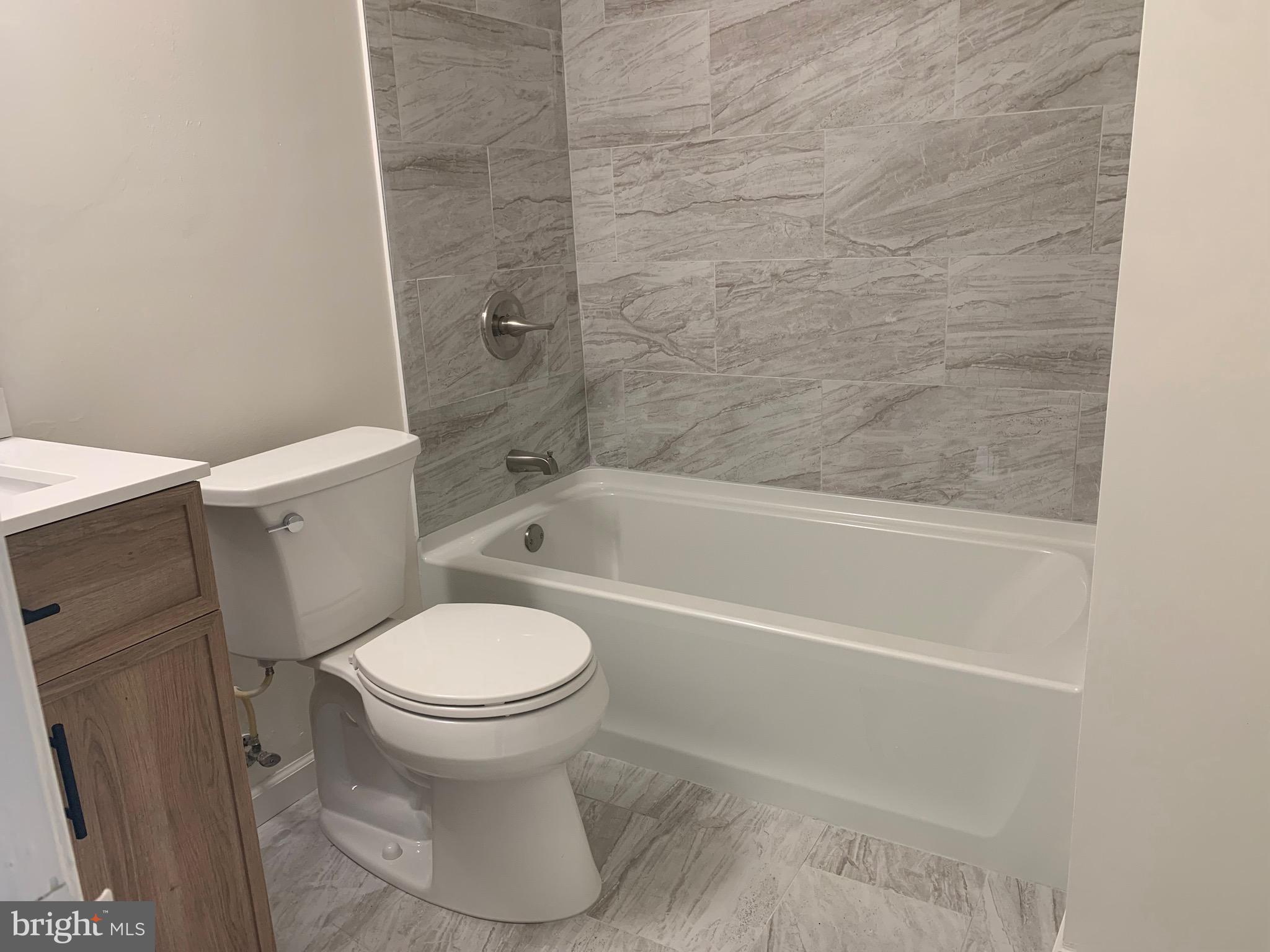 5656 Shadow Fall Terrace Columbia, MD 21045 - Photo 19 of 41 a white toilet sitting next to a bath tub