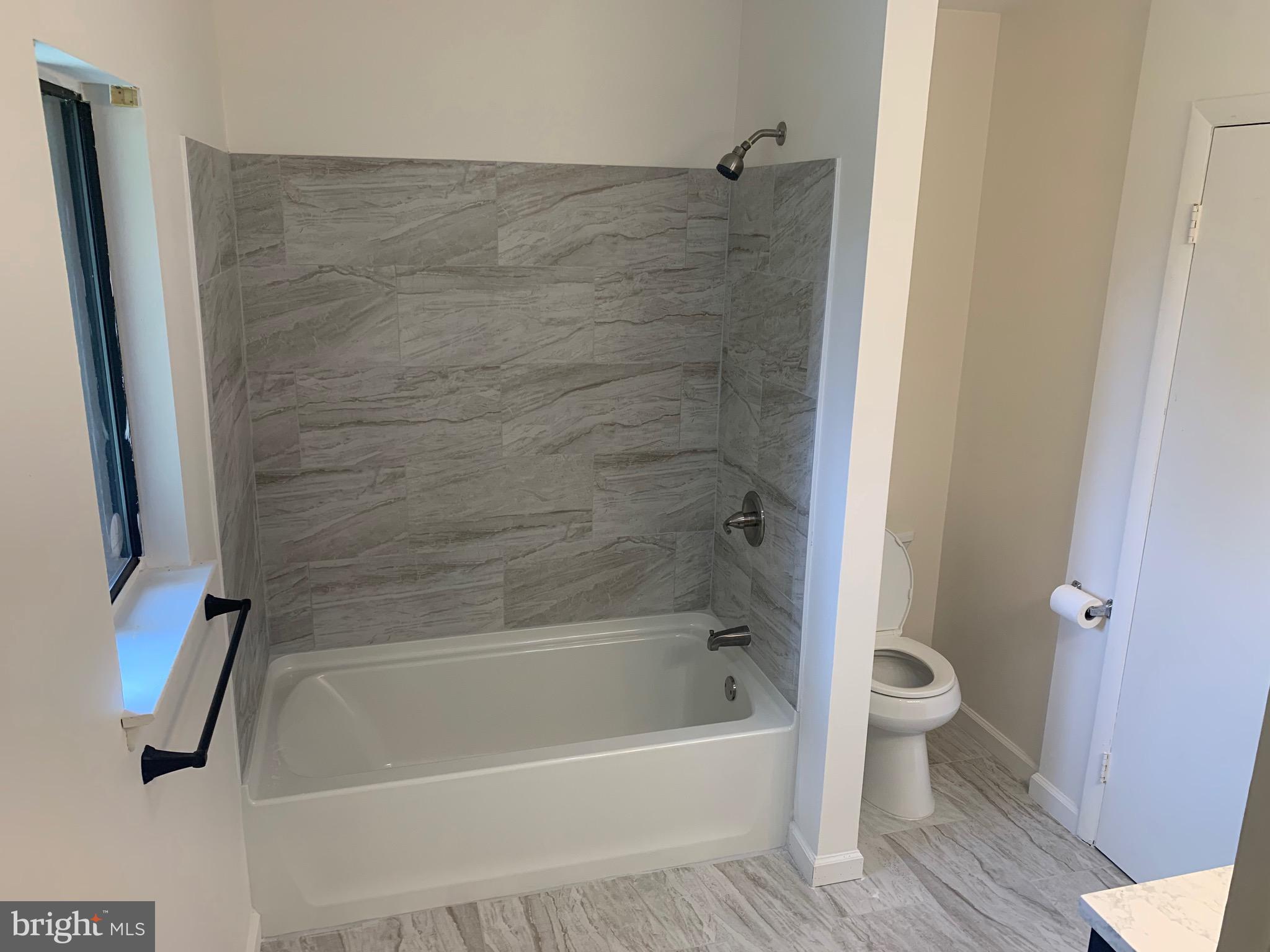 5656 Shadow Fall Terrace Columbia, MD 21045 - Photo 23 of 41 a bathroom with a bathtub and a toilet