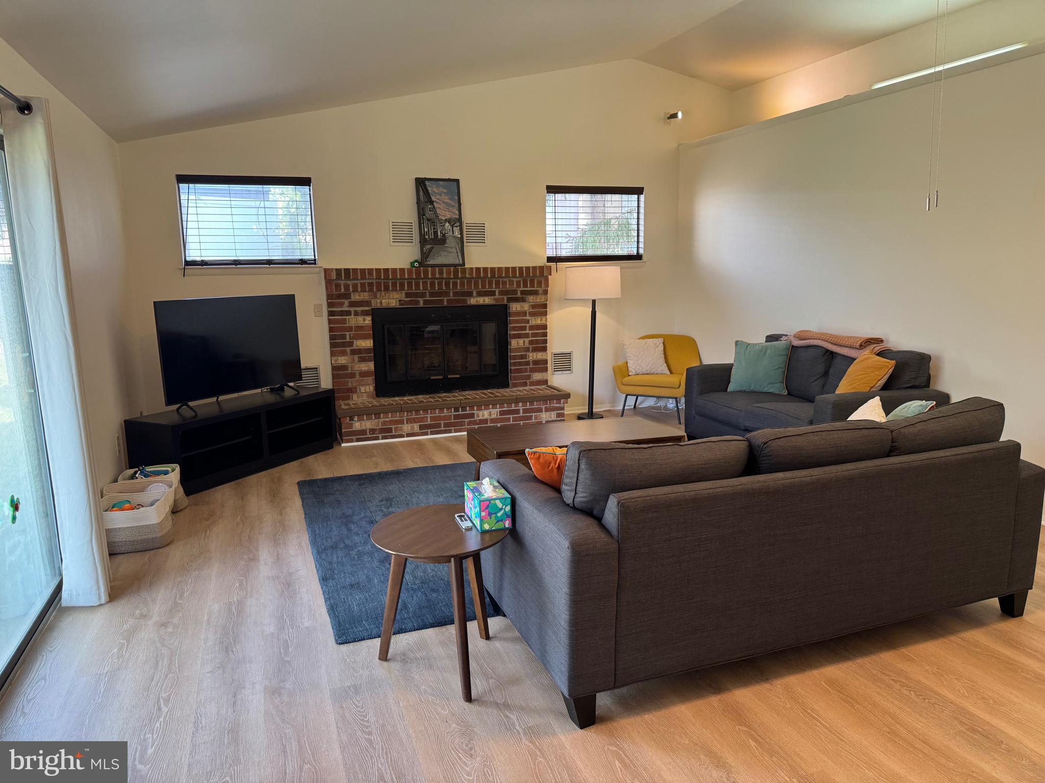 5656 Shadow Fall Terrace Columbia, MD 21045 - Photo 26 of 41 a living room with furniture and a flat screen tv