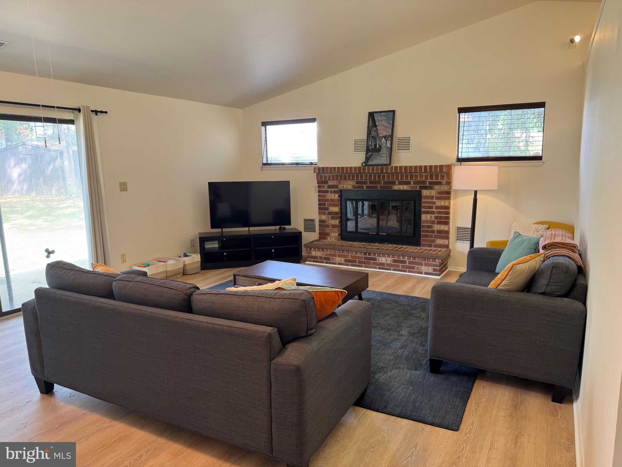 5656 Shadow Fall Terrace Columbia, MD 21045 - Photo 31 of 41 a living room with furniture and a fireplace
