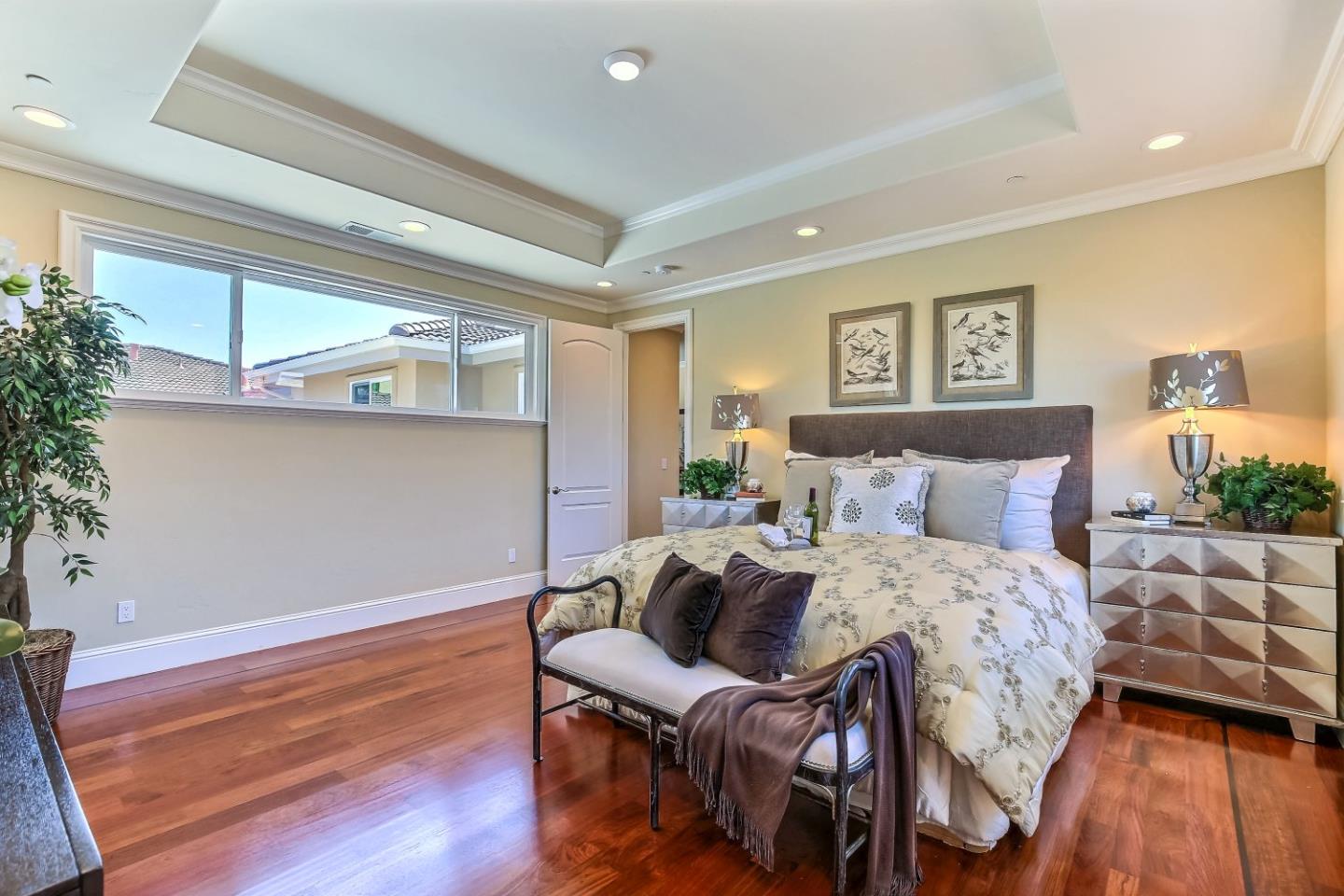 10438 North Stelling Road Cupertino, CA 95014 - Photo 12 of 22 a bedroom with a bed and wooden floor
