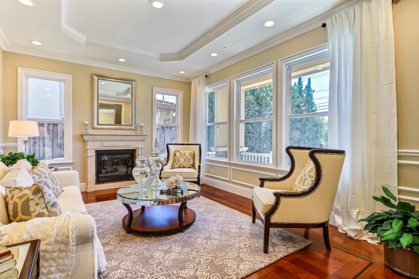 10438 North Stelling Road Cupertino, CA 95014 - Photo 2 of 22 a living room with furniture and a fireplace