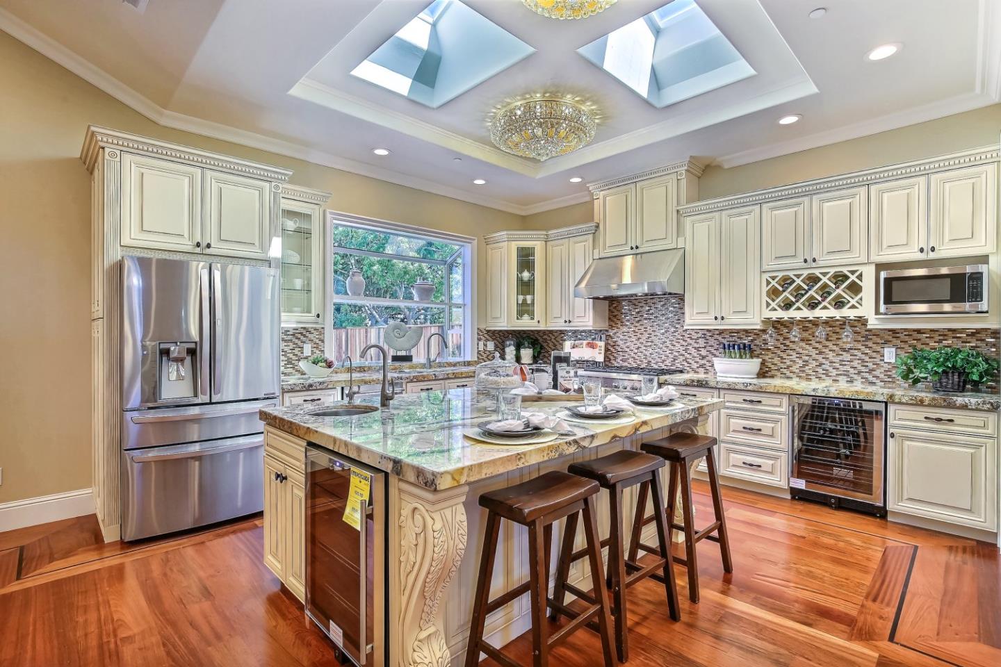 10438 North Stelling Road Cupertino, CA 95014 - Photo 5 of 22 a kitchen with stainless steel appliances granite countertop a sink stove and refrigerator