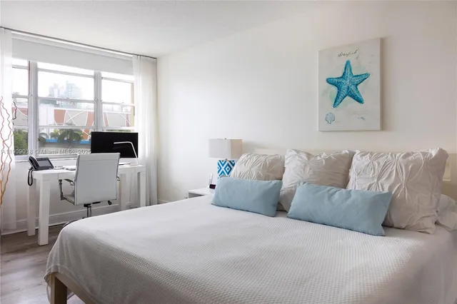 a bedroom with a balcony a bed and a couch