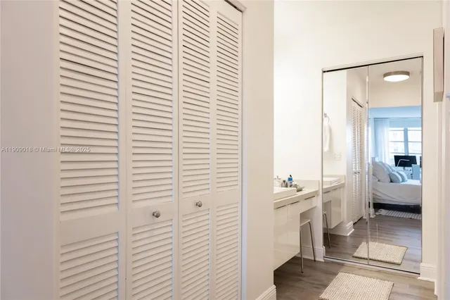 a bathroom with a double vanity sink and a window