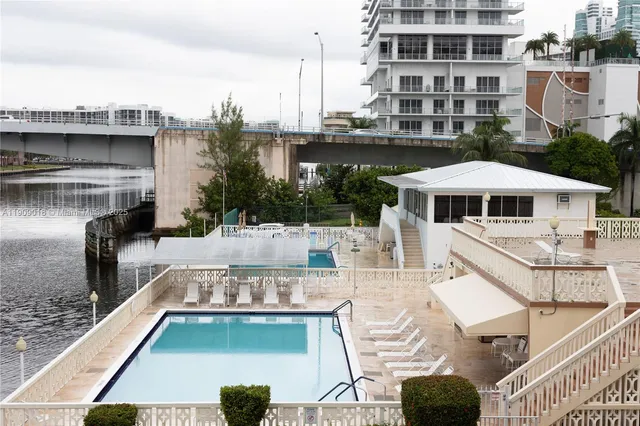 a view of a swimming pool with a patio
