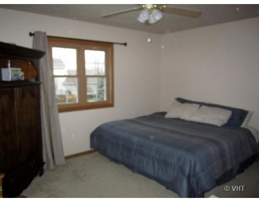 13331 Cathy Lane Plainfield, IL 60585 - Photo 16 of 16 a bedroom with a bed and a window