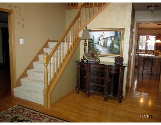 13331 Cathy Lane Plainfield, IL 60585 - Photo 2 of 16 a view of entryway and hall with wooden floor