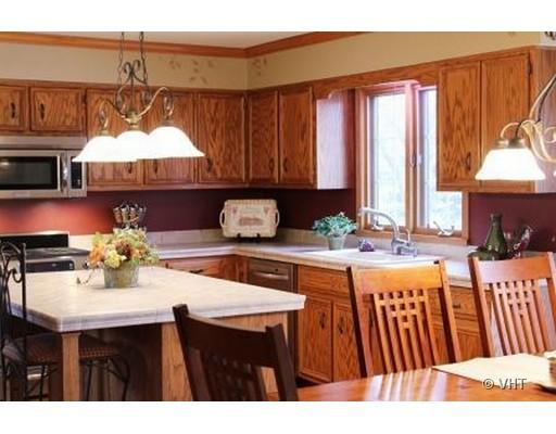 13331 Cathy Lane Plainfield, IL 60585 - Photo 5 of 16 a kitchen with a sink cabinets and a window
