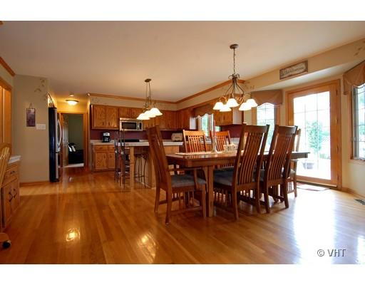 13331 Cathy Lane Plainfield, IL 60585 - Photo 6 of 16 a view of a dining room with furniture window and wooden floor