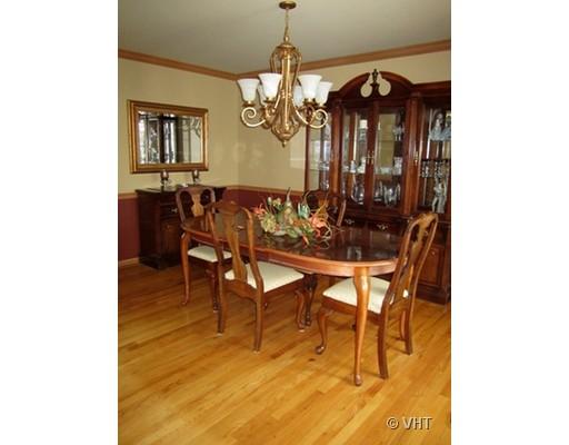13331 Cathy Lane Plainfield, IL 60585 - Photo 7 of 16 a view of a dining room with furniture and a chandelier