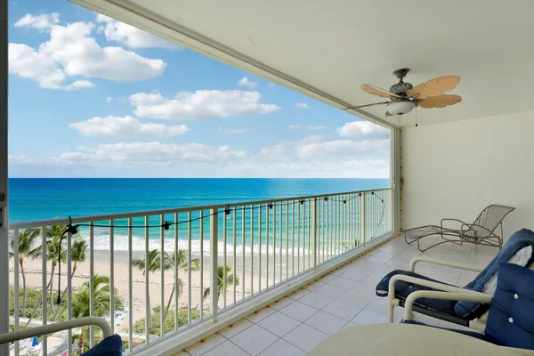 a view of a balcony with a ceiling fan