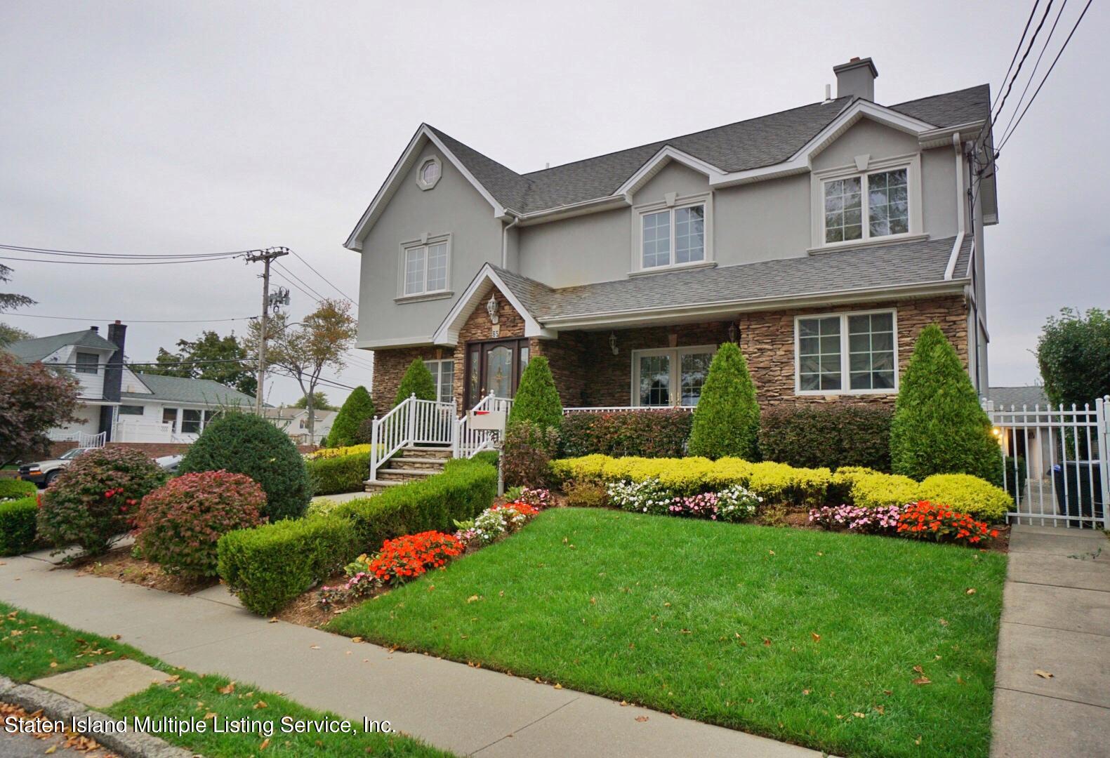 65 Lander Avenue Staten Island, NY 10314 - Photo 1 of 53 a front view of house with yard and green space