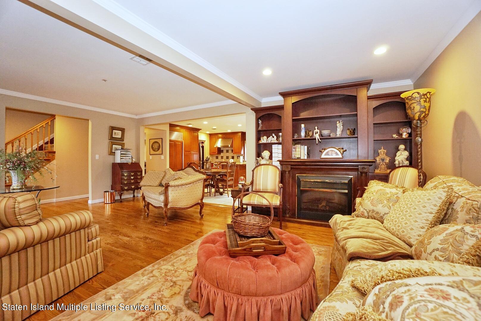 65 Lander Avenue Staten Island, NY 10314 - Photo 14 of 53 a living room with furniture and a large window